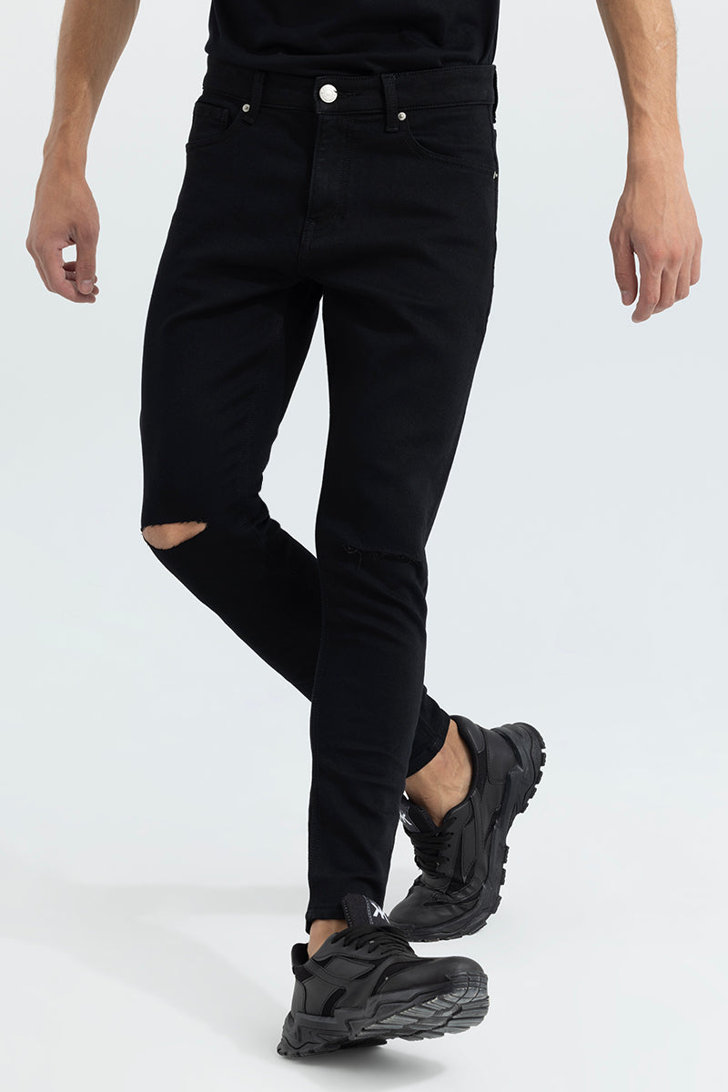 Knee cut black jeans discount